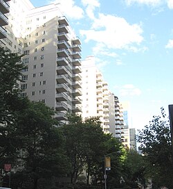 Looking east from Third Avenue along East 65th Street at Manhattan House, on a sunny afternoon.