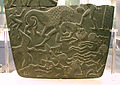 Image 29Possible prisoners and wounded men of the Buto-Maadi culture devoured by animals, while one is led by a man in long dress, probably an Egyptian official (fragment, top right corner). Battlefield Palette. (from Prehistoric Egypt)