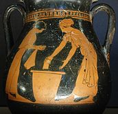 Photograph of a red-figure vase showing two women washing clothes