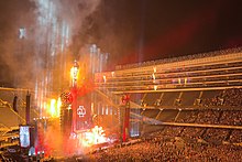 Flames burst from a backpack on Rammstein singer Till Lindemann during a performance at Soldier Field.