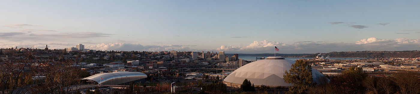 Panorama of Tacoma from the McKinley neighborhood with the Tacoma Dome in the foreground and Puget Sound in the background.
