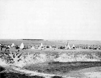 Reenactment of U.S. troops surrounding the Lakota at Wounded Knee (1913).