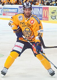 Frans Nielsen skating with his hockey stick as a Rauman Lukko team member.