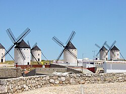 La Mancha's traditional windmills like these, still standing at Campo de Criptana, were immortalized in the novel Don Quixote.