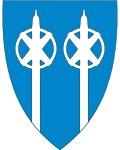Kommunevåpenet i Trysil, hvor to skistaver symboliserer bygdas skihistorie.