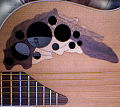 Leaf sound hole in an Ovation Adamas guitar