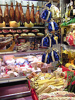 Array of meats, cheeses and bottles