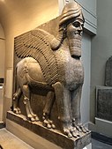 Lamassu, initially depicted as a goddess in Sumerian times, when it was called Lamma, it was later depicted from Assyrian times as a hybrid of a human, bird, and either a bull or lion—specifically having a human head, the body of a bull or a lion, and bird wings, under the name Lamassu.[80][81]