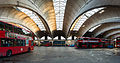 Image 12 Stockwell Garage Photograph: David Iliff An interior view of Stockwell Garage, a large bus garage in Stockwell, London, designed by Adie, Button and Partners and opened in 1952. The 393-foot-long (120 m) roof structure, seen here, is supported by ten very shallow "two-hinged" arched ribs, between which are cantilevered barrel vaults topped by large skylights. The garage, which could originally hold 200 buses, has been a Grade II* Listed Building since 1988. More selected pictures