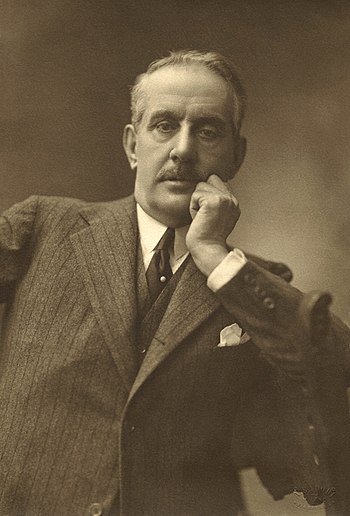 A sepia-toned photograph of Giacomo Puccini.