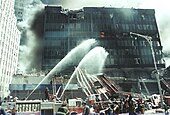 Firefighters spraying water onto 6 WTC.