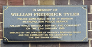 Plaque in memory of PC Tyler on the outside wall of Tottenham Police Station, London.