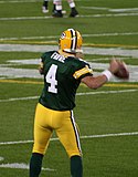 A photo of Brett Favre from behind throwing a football