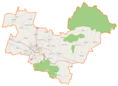 Mapa konturowa gminy Krotoszyn, blisko centrum po lewej na dole znajduje się punkt z opisem „Dino Polska SA”