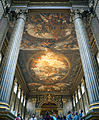 The Painted Hall at the Old Royal Naval College in Greenwich, London, England, designed by Sir Christopher Wren and Nicholas Hawksmoor. The paintings by Sir James Thornhill comprise architectural trompes l'œil; for instance, the Corinthian columns look fluted whilst the far wall depicts pilasters and an entablature. In practice none of these elements exist in the third dimension
