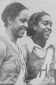 Photo of Howard and other teenage girl smiling together, wearing Britannia High track meet uniform