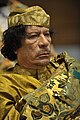Image 15 Muammar Gaddafi Photograph: Jesse B. Awalt/US Navy Muammar Gaddafi (c. 1942 – 2011) was a Libyan revolutionary and politician. Taking power in a coup d'etat, he ruled as Revolutionary Chairman of the Libyan Arab Republic from 1969 to 1977 and then as the "Brotherly Leader" of the Great Socialist People's Libyan Arab Jamahiriya from 1977 to 2011, when he was ousted in the Libyan Civil War. Initially developing his own variant of Arab nationalism and Arab socialism known as the Third International Theory, he later embraced Pan-Africanism and served as Chairperson of the African Union from 2009 to 2010. More selected portraits