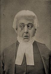 A sepia photo of the face of an actor, portraying the judge with an exaggerated expression of distaste