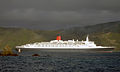 QE2 slips out the entrance in a following breeze, 2006