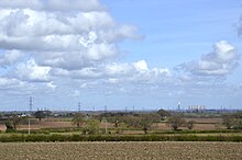 What remains of Megawatt Valley: the disused and part-demolished West Burton and Cottam Power Stations, described as "Beacons in North Nottinghamshire's Skyline" by EDF, can be seen here, as viewed from Ossington, approximately 13 miles away as the crow flies. Out of frame, to the right, the closer High Marnham Power Station was once even more prominent before its demolition. The two power stations in shot will follow in its footsteps in the coming 4 years. (Taken 2024/03/30)