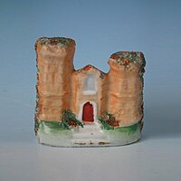 Small staffordshire pottery figure of a castle 2.6ins tall, circa 1860.