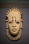 Pendant mask; by artists of the Edo people (Nigeria); 16th century (?); ivory and iron; height: 24.5 cm; British Museum, London[98]