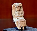 Mesopotamian female deity seated on a chair, Old-Babylonian fired clay plaque from Ur