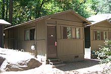 A photo of a wooden duplex cabin located in Curry Village.
