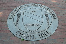 A seal for a school that contains the name and the date of founding.