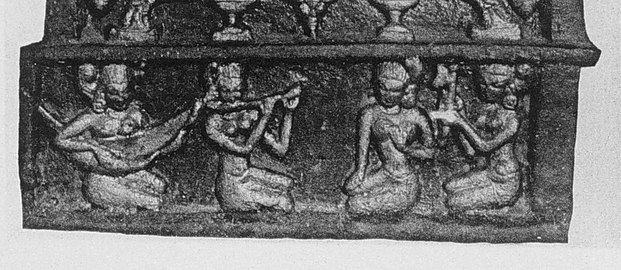 12th century A.D. sculpture from the Ananda Temple at Bagan, The women sing and play to the prince. From the left: harp, flute, singer, clapper.