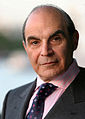 Image 4 David Suchet Photo credit: Phil Chambers A portrait of David Suchet OBE, an English actor best known for his television portrayal of Agatha Christie's Hercule Poirot in the television series Agatha Christie's Poirot. For this role, he earned a 1991 British Academy Television Award (BAFTA) nomination. In preparation for the role he says that he read every novel and short story, and compiled an extensive file on Poirot. More selected portraits