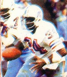 Image from a ticket stub of Earl Campbell in a Houston Oilers uniform rushing the ball.