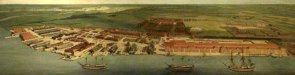 Chatham Dockyard: from right to left (south to north) on river bank are: two Anchor Wharf Storehouses (Rope House behind); two shipbuilding slips (and Commissioner's House with garden, and beyond, Sail and Colour Loft); two dry docks (Clock Tower Storehouse behind); the old Smithery; two more dry docks (and beyond, Masthouses and Mouldloft); more building slips and Boat Houses. In the distance, ships at anchor on Gillingham Reach. Painting by Joseph Farington, 1785.[13]