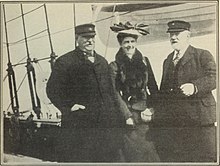 Grover Cleveland, Frances Cleveland, and Elisa Benedict stand on the deck of a boat