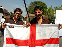 Govinda and Akshay Kumar holding an English flag