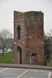 A ruined church tower in red stone