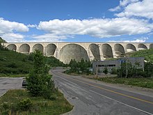 A large concrete dam with multiple arches