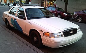 A STM Transit Safety vehicle, which is a Ford Crown Victoria Police Interceptor
