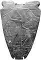 Narmer Palette: a glyph above left-warrior, (similar to a fortification compound?)