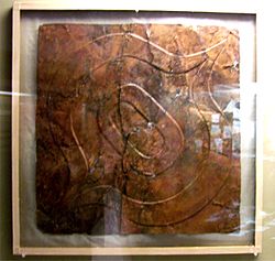 Ogee motif-repousse copper plate from the Etowah Site