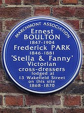 Circular blue plaque which reads: Ernest Boulton 1847–1904 Frederick Park 1846–1881 'Stella & Fanny' Victorian cross-dressers lodged at 13 Wakefield Street on this site 1868–1870