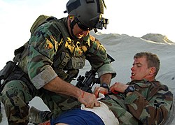 US Navy 081210-N-5366K-073 A Special Warfare Combatant-craft Crewman treats an injured teammate during a casualty assistance and evacuation scenario.jpg