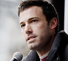 Ben Affleck speaks into a microphone