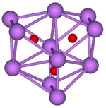 The stick and ball diagram shows three regular octahedra, which are connected to the next one by one surface and the last one shares one surface with the first. All three have one edge in common. All eleven vertices are purple spheres representing caesium, and at the center of each octahedron is a small red sphere representing oxygen.