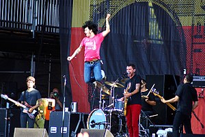 At the Drive-In live in 2012. From left to right: Rodríguez-López, Bixler-Zavala, Ward, Hajjar, and Hinojos.
