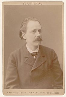 Middle-aged man, receding hair, neatly moustached, looking slightly away from the camera, in a cabinet card mount