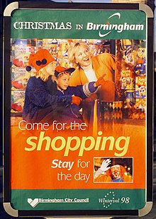 "Poster with the headline 'Christmas in Birmingham', then a picture of a mother and children, looking at toys, with the words 'Come for the shopping, stay for the day'. Below that, in smaller type, the Birmingham City Council and Winterval 1998 logos."