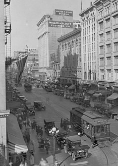 1923, view north from 7th St. to east side of 600 block, S. Broadway. Note Mullen & Bluett store.