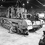 Auxiliary Territorial Service (ATS) women working on a Churchill tank at a Royal Army Ordnance Corps depot, 10 October 1942. H24517 - Restoration.jpg