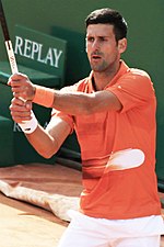 Novak Đoković with a tennis racket